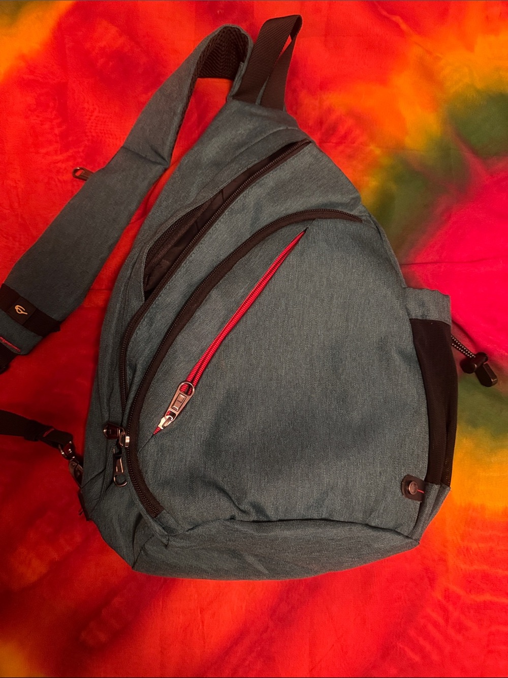 Teal Sling Backpack with Red Accent